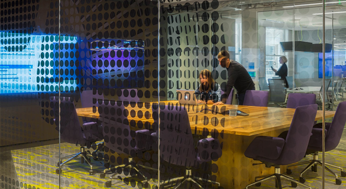 AOL Conference room with printed glass, table, and media