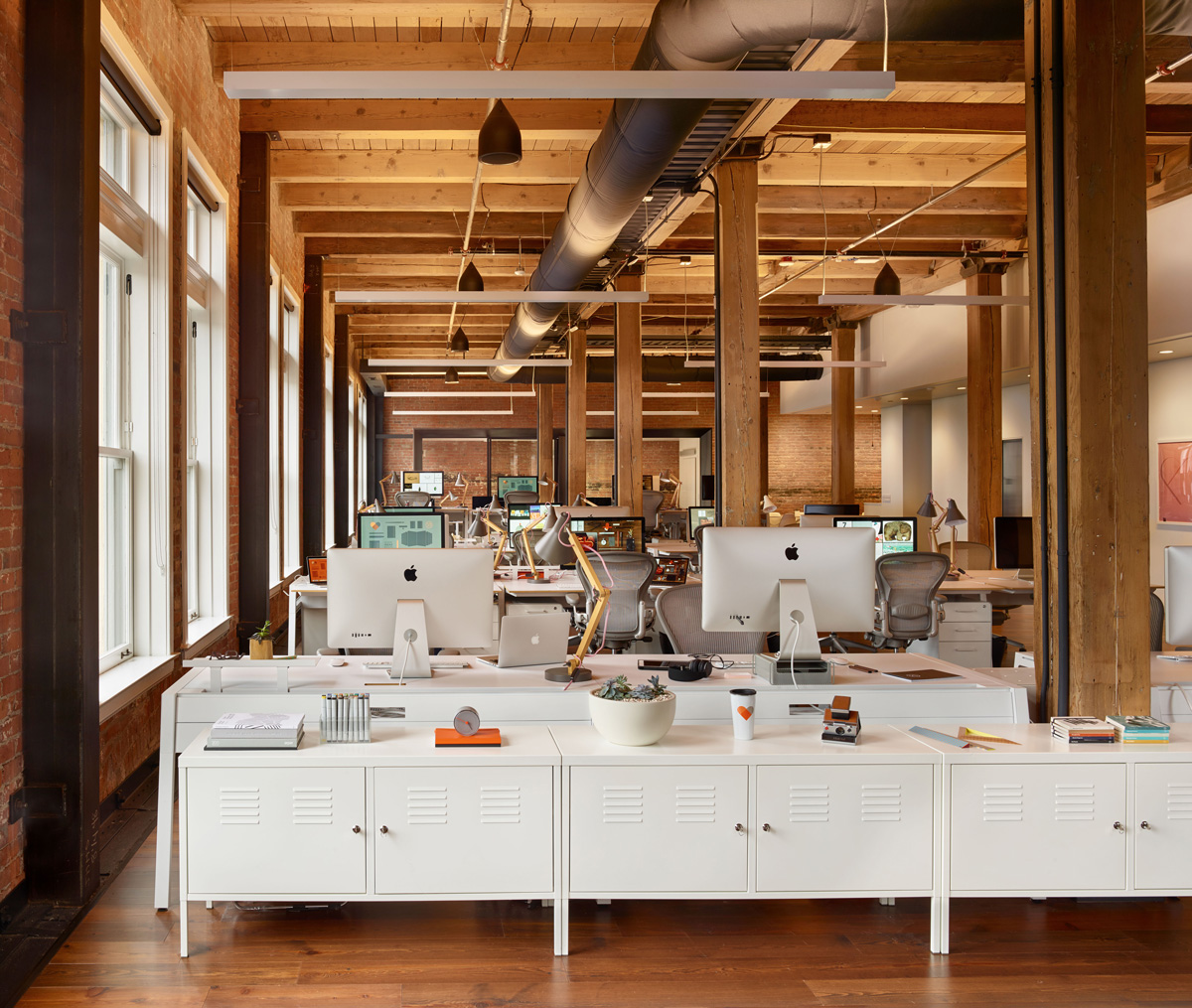 Fifty Three office desks, exposed beams and nautral wood