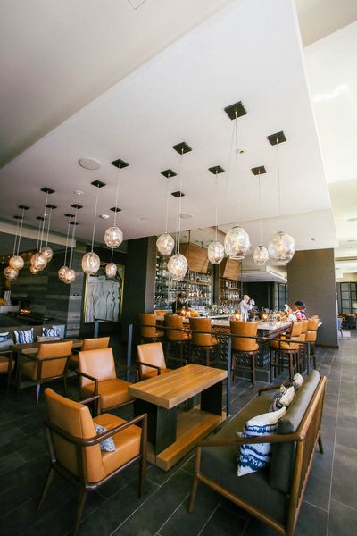 Interior view of restaurant with acoustical ceiling and custom lighting