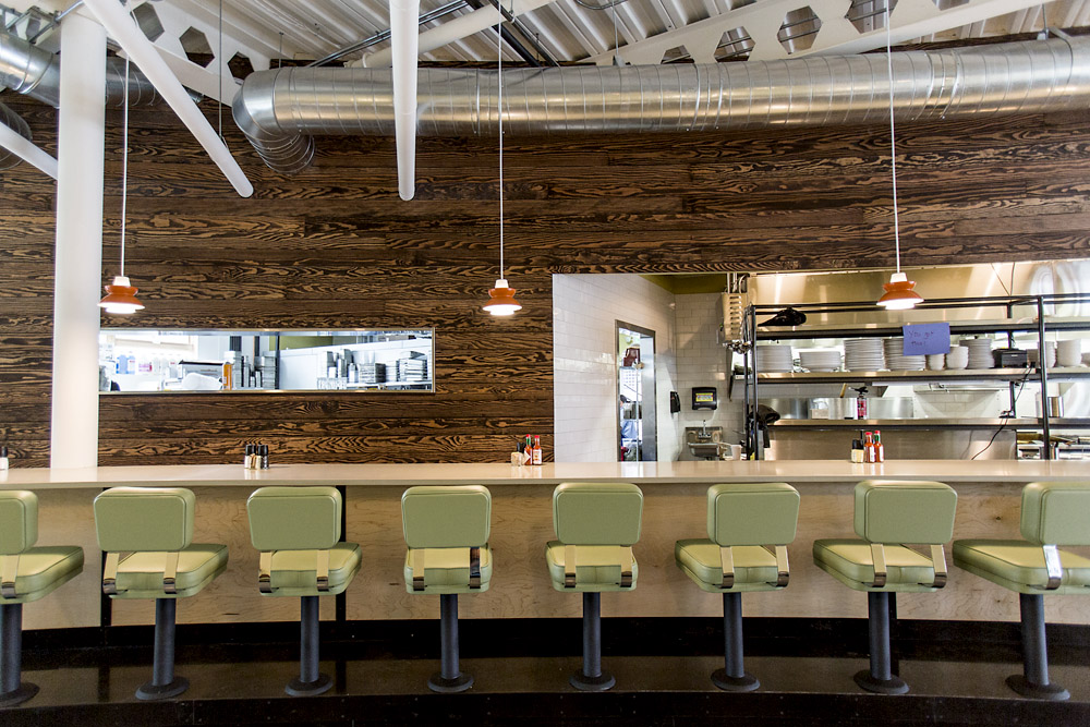Skillet Diner bar seating, natural wood panels